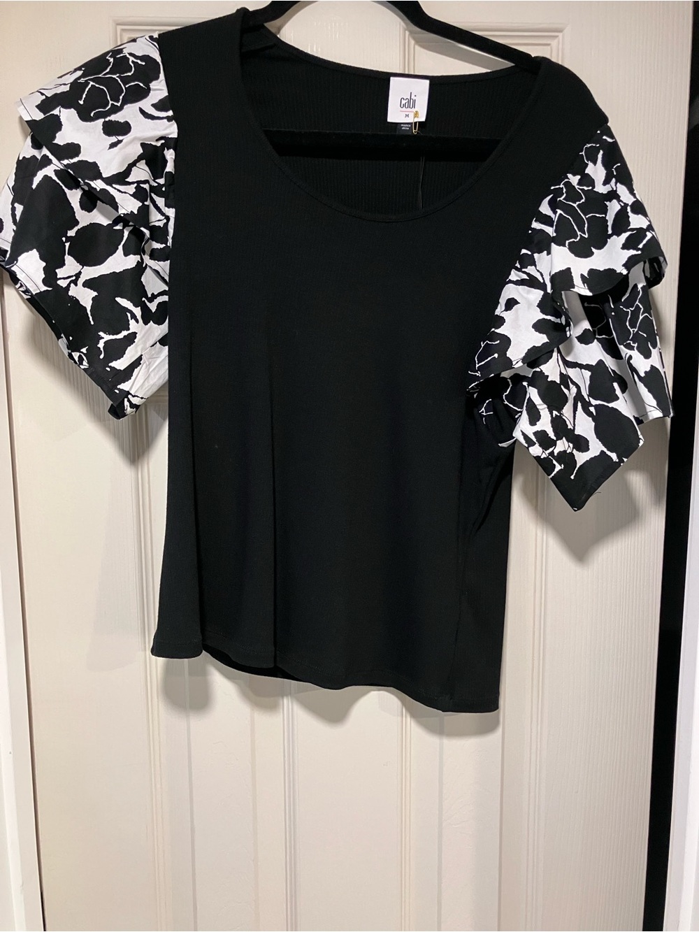 CAbi Black rib knit top with Black & White Floral woven Ruffle Sleeves